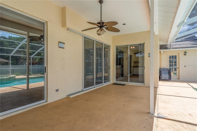 627 Belted Kingfisher Dr N, Palm Harbor, FL 34683 - view of patio featuring ceiling fan, glass enclosure, and a pool with connected hot tub