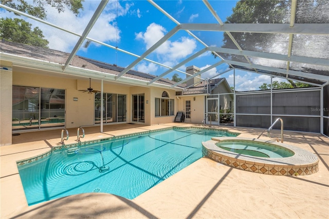 627 Belted Kingfisher Dr N, Palm Harbor, FL 34683 - view of pool featuring a patio area, a ceiling fan, a lanai, and a pool with connected hot tub
