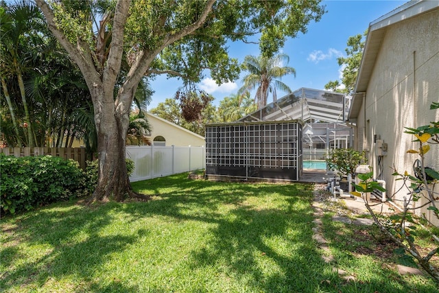 627 Belted Kingfisher Dr N, Palm Harbor, FL 34683 - view of yard featuring glass enclosure
