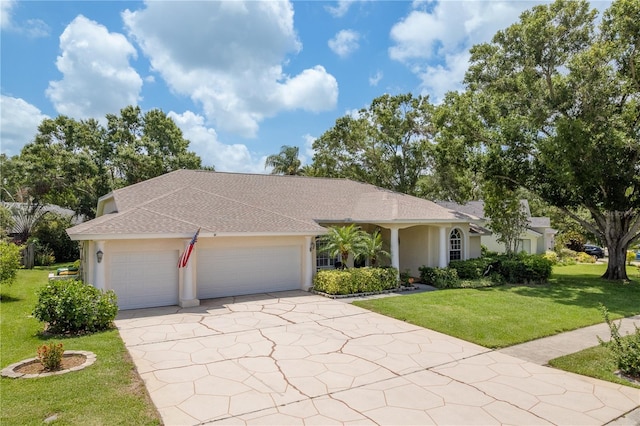627 Belted Kingfisher Dr N, Palm Harbor, FL 34683 - ranch-style house featuring an attached garage, a front yard, concrete driveway, and stucco siding