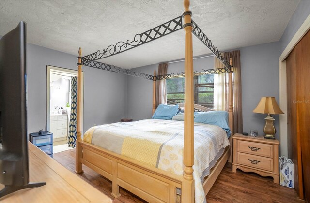 28 N Edinburgh Dr, Inverness, FL 34450 - bedroom with a textured ceiling and wood finished floors
