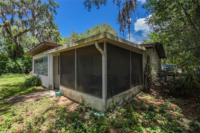 28 N Edinburgh Dr, Inverness, FL 34450 - view of side of home featuring a sunroom