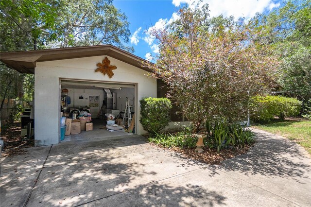 28 N Edinburgh Dr, Inverness, FL 34450 - garage with concrete driveway