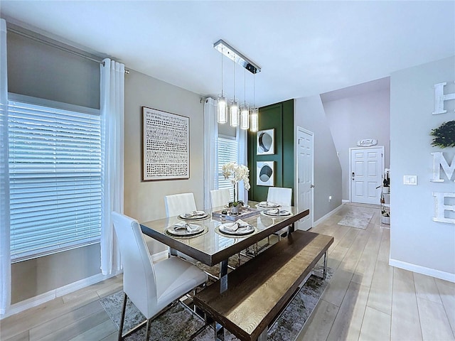 34056 Scarlet Sage Ct, Wesley Chapel, FL 33545 - dining room with baseboards and light wood-style floors