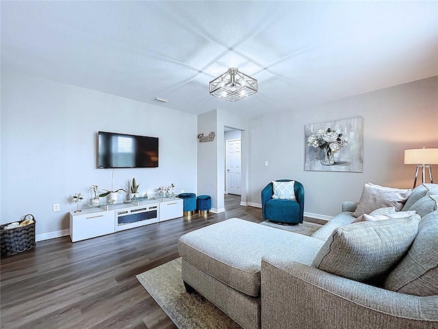 34056 Scarlet Sage Ct, Wesley Chapel, FL 33545 - living room with baseboards and dark wood-style floors