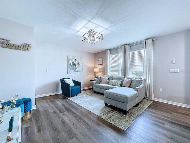 34056 Scarlet Sage Ct, Wesley Chapel, FL 33545 - living room with wood finished floors, baseboards, and a textured ceiling