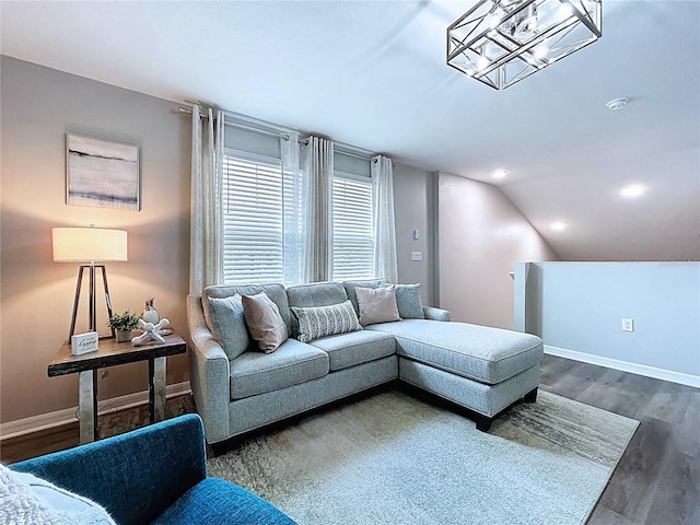 34056 Scarlet Sage Ct, Wesley Chapel, FL 33545 - living area featuring wood finished floors, baseboards, and lofted ceiling