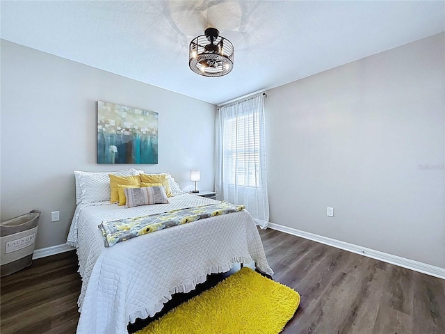 34056 Scarlet Sage Ct, Wesley Chapel, FL 33545 - bedroom with baseboards and wood finished floors