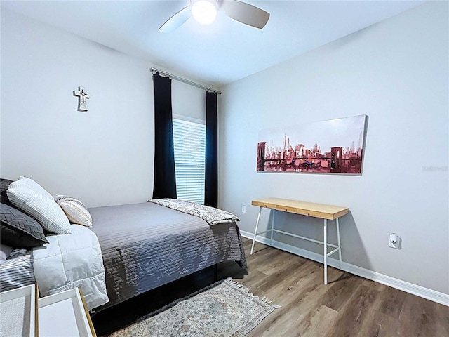 34056 Scarlet Sage Ct, Wesley Chapel, FL 33545 - bedroom featuring wood finished floors, a ceiling fan, and baseboards