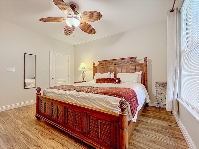 2724 Via Murano Unit 615, Clearwater, FL 33764 - bedroom with wood finished floors, baseboards, and a ceiling fan