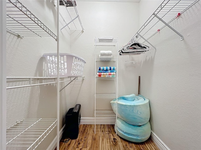 2724 Via Murano Unit 615, Clearwater, FL 33764 - spacious closet featuring wood finished floors