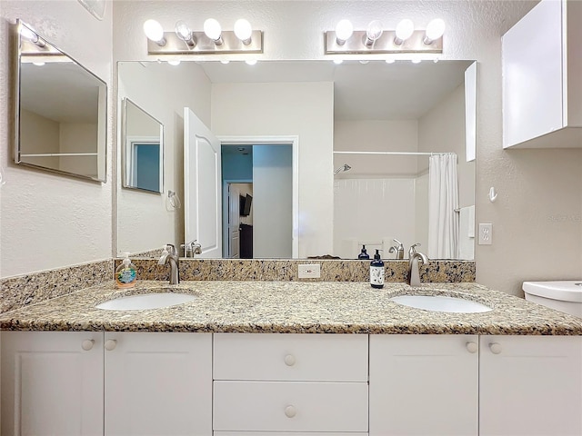 2724 Via Murano Unit 615, Clearwater, FL 33764 - full bathroom with a shower with curtain, double vanity, and toilet