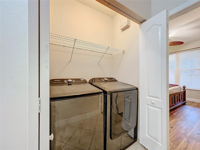 2724 Via Murano Unit 615, Clearwater, FL 33764 - clothes washing area featuring washing machine and dryer and wood finished floors