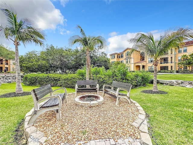2724 Via Murano Unit 615, Clearwater, FL 33764 - view of green lawn featuring a fire pit