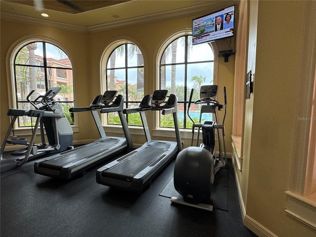 2724 Via Murano Unit 615, Clearwater, FL 33764 - exercise room featuring crown molding, baseboards, healthy amount of natural light, and recessed lighting