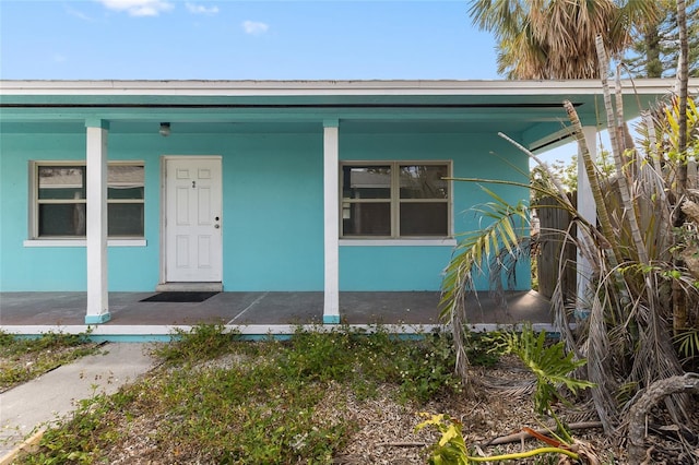 410 73rd Ave, St Pete Beach, FL 33706 - view of front of property with a porch