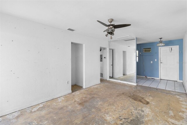 410 73rd Ave, St Pete Beach, FL 33706 - unfurnished room featuring a ceiling fan, baseboards, and a wall mounted AC