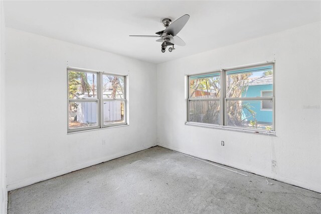 410 73rd Ave, St Pete Beach, FL 33706 - spare room featuring plenty of natural light and a ceiling fan