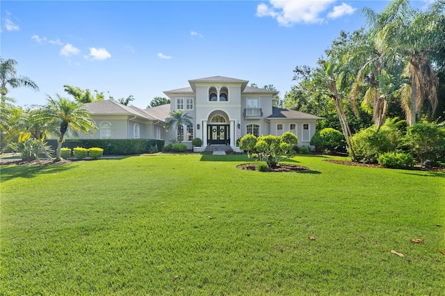 4512 Cheval Blvd, Lutz, FL 33558 - mediterranean / spanish-style house featuring french doors, a front lawn, and stucco siding