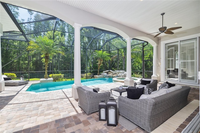 4512 Cheval Blvd, Lutz, FL 33558 - view of patio featuring a pool with connected hot tub, glass enclosure, an outdoor hangout area, and ceiling fan