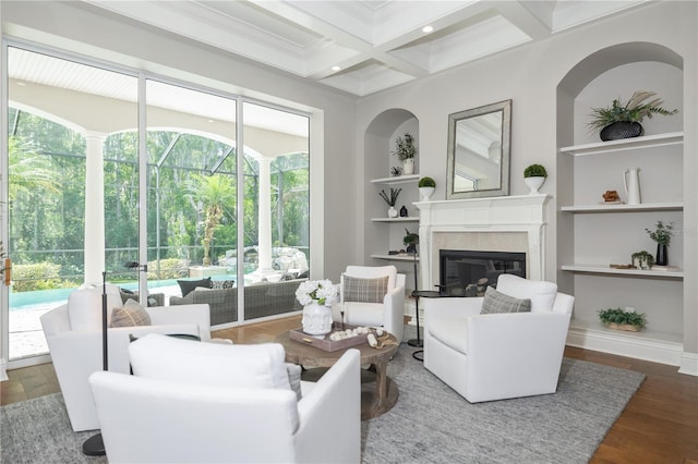 4512 Cheval Blvd, Lutz, FL 33558 - living room with beam ceiling, built in features, wood finished floors, a fireplace, and coffered ceiling
