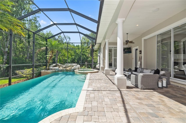 4512 Cheval Blvd, Lutz, FL 33558 - view of pool featuring a patio, ceiling fan, a pool with connected hot tub, a lanai, and an outdoor living space