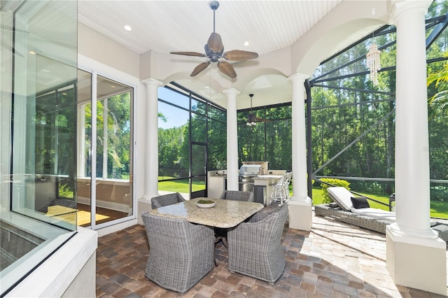 4512 Cheval Blvd, Lutz, FL 33558 - sunroom / solarium featuring exterior kitchen, ceiling fan, and outdoor dining space