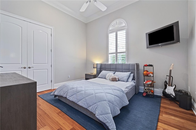 4512 Cheval Blvd, Lutz, FL 33558 - bedroom with ornamental molding, wood finished floors, a closet, and baseboards