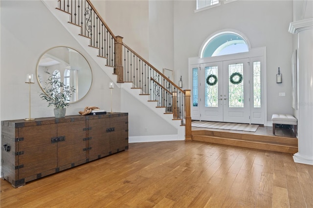 4512 Cheval Blvd, Lutz, FL 33558 - entrance foyer featuring a high ceiling, light wood-type flooring, stairway, and baseboards