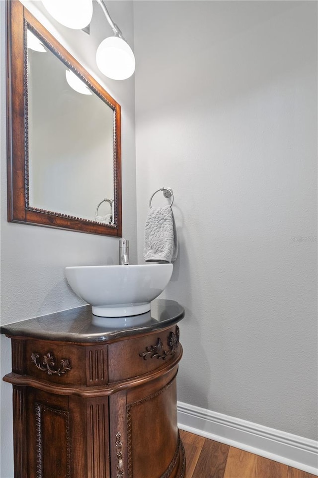 4512 Cheval Blvd, Lutz, FL 33558 - bathroom with baseboards, wood finished floors, and vanity