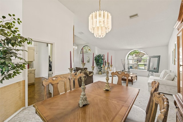 5434 Wellfield Rd, New Port Richey, FL 34655 - dining room with a chandelier and baseboards