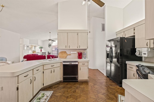 5434 Wellfield Rd, New Port Richey, FL 34655 - kitchen with a ceiling fan, black appliances, a peninsula, and a sink