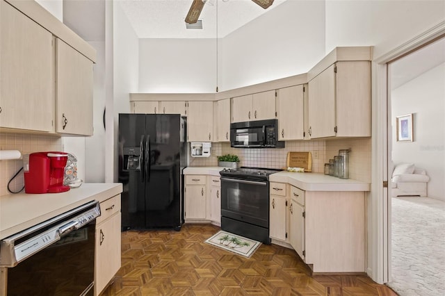 5434 Wellfield Rd, New Port Richey, FL 34655 - kitchen with black appliances, light countertops, ceiling fan, tasteful backsplash, and cream cabinetry