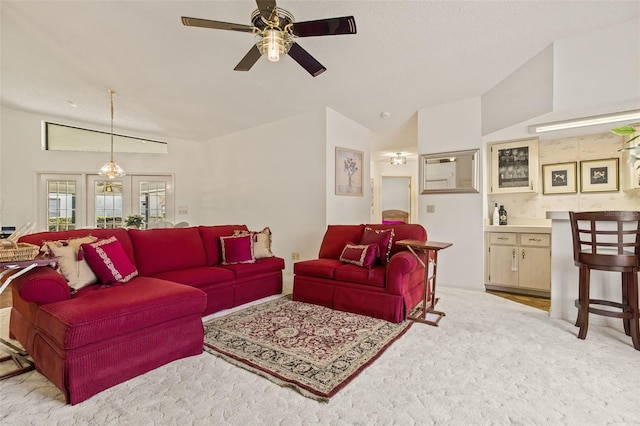 5434 Wellfield Rd, New Port Richey, FL 34655 - carpeted living area featuring ceiling fan and vaulted ceiling