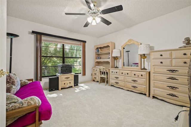 5434 Wellfield Rd, New Port Richey, FL 34655 - bedroom with light colored carpet, a textured ceiling, and ceiling fan