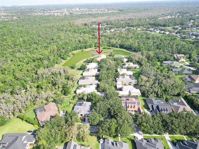 15101 Kestrelglen Way, Lithia, FL 33547 - aerial overview of property's location featuring a heavily wooded area, nearby suburban area, and a golf club
