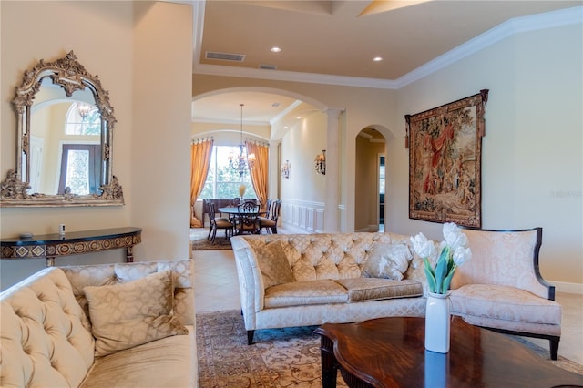 15101 Kestrelglen Way, Lithia, FL 33547 - living room with arched walkways, ornamental molding, decorative columns, tile patterned floors, and recessed lighting
