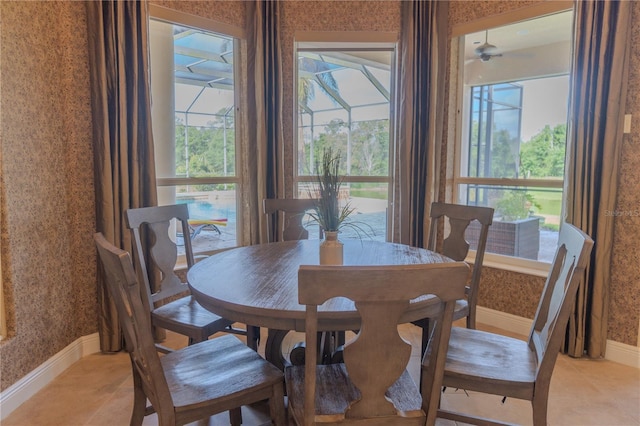 15101 Kestrelglen Way, Lithia, FL 33547 - dining space featuring wallpapered walls, baseboards, and light tile patterned floors