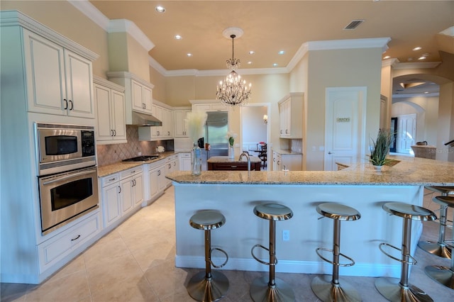 15101 Kestrelglen Way, Lithia, FL 33547 - kitchen featuring built in appliances, light stone counters, decorative backsplash, a breakfast bar area, and recessed lighting