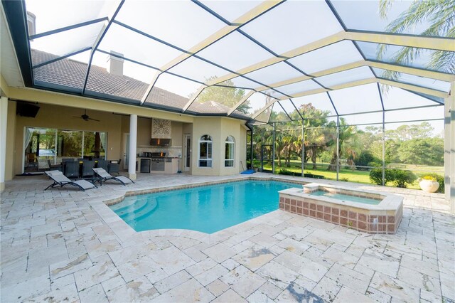 15101 Kestrelglen Way, Lithia, FL 33547 - view of pool featuring an outdoor kitchen, a patio, a ceiling fan, and glass enclosure
