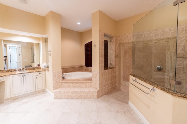 15101 Kestrelglen Way, Lithia, FL 33547 - full bathroom featuring a garden tub, vanity, a walk in shower, tile patterned flooring, and recessed lighting