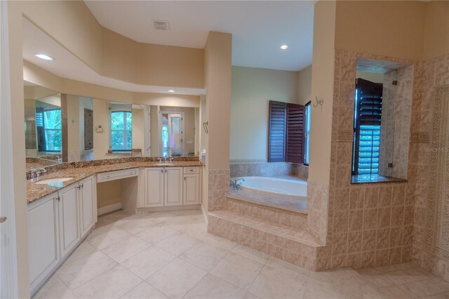 15101 Kestrelglen Way, Lithia, FL 33547 - full bathroom with a bath, vanity, and tile patterned flooring