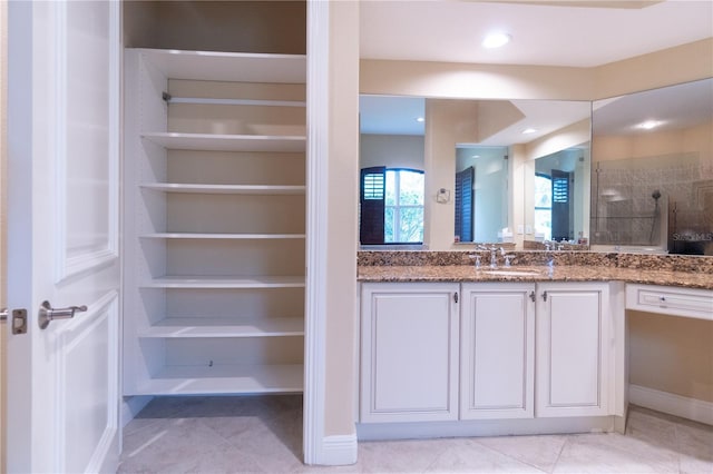 15101 Kestrelglen Way, Lithia, FL 33547 - full bathroom with vanity, tile patterned flooring, and baseboards