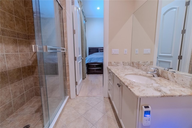 15101 Kestrelglen Way, Lithia, FL 33547 - full bathroom with vanity, a shower stall, ensuite bath, and tile patterned floors