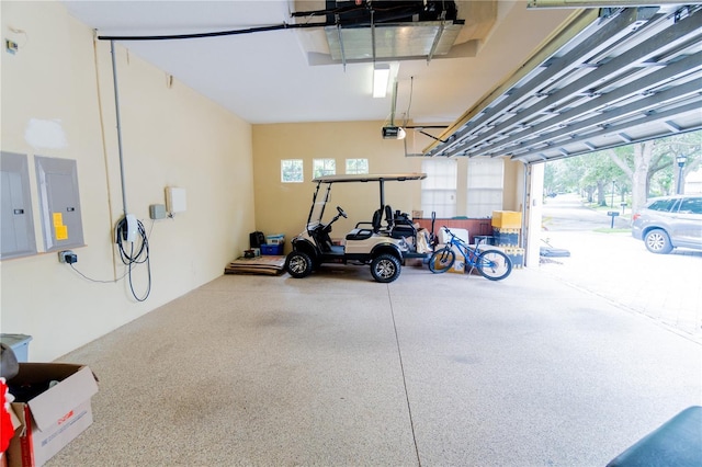 15101 Kestrelglen Way, Lithia, FL 33547 - garage featuring electric panel and a garage door opener