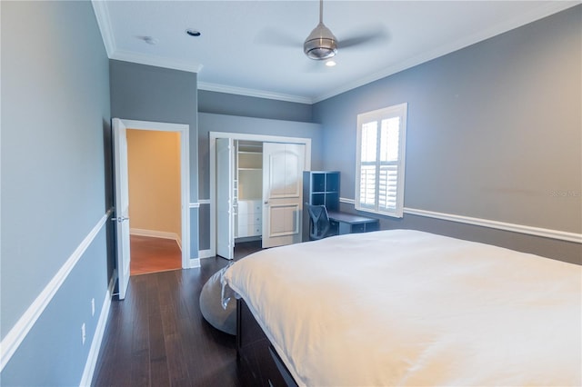 15101 Kestrelglen Way, Lithia, FL 33547 - bedroom with a closet, dark wood finished floors, baseboards, crown molding, and a ceiling fan