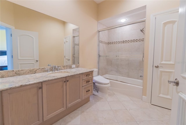 15101 Kestrelglen Way, Lithia, FL 33547 - bathroom with vanity, toilet, tile patterned floors, and combined bath / shower with glass door