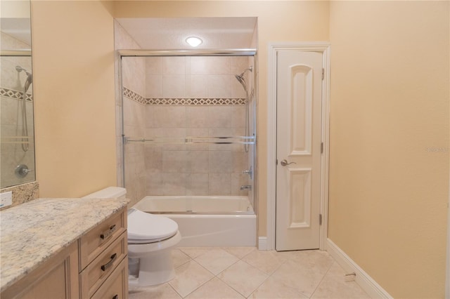 15101 Kestrelglen Way, Lithia, FL 33547 - full bath featuring tile patterned flooring, toilet, vanity, and combined bath / shower with glass door