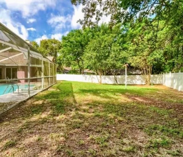 14273 Nugent Cir, Spring Hill, FL 34609 - view of yard featuring a lanai