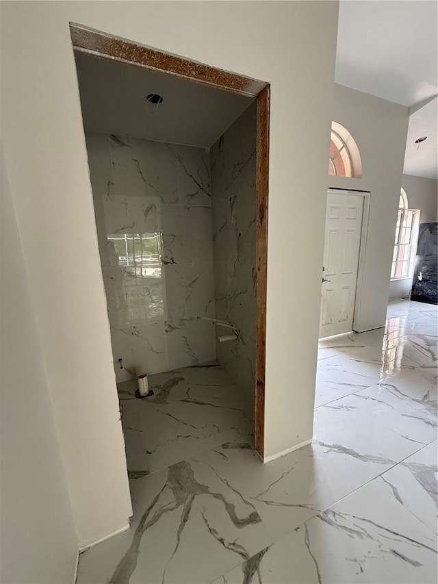 14273 Nugent Cir, Spring Hill, FL 34609 - bathroom featuring marble tiled floors and a marble finish shower
